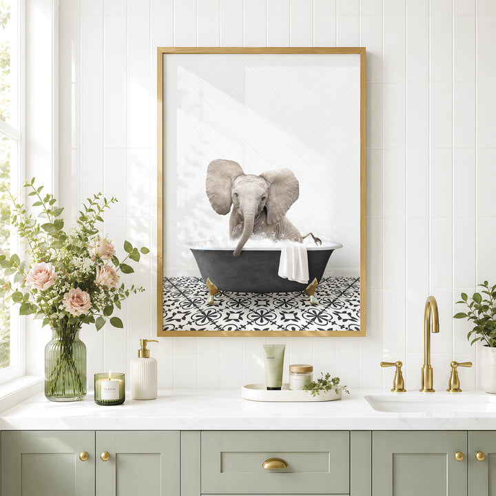 a framed picture of an elephant sitting in a bathtub, surrounded by various bathroom accessories and decor.