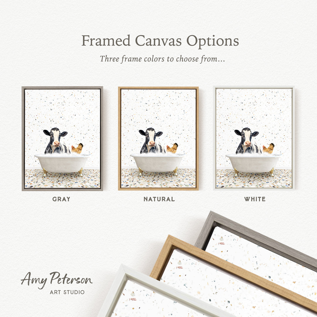 three framed canvas options featuring a cow sitting in a bathtub, with each option having a different frame color: gray, natural, and white.