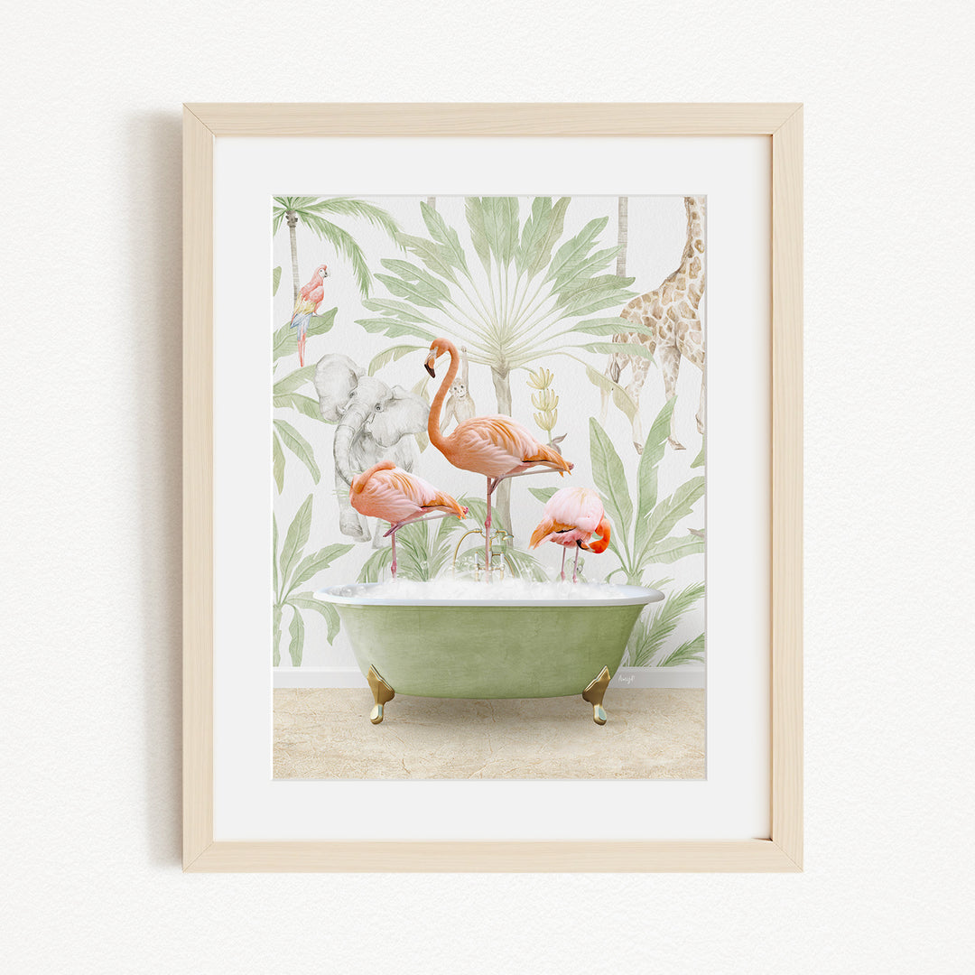 A framed print depicting a pink flamingo standing in a green bathtub, surrounded by a tropical jungle scene with palm trees, a giraffe, and other animals.