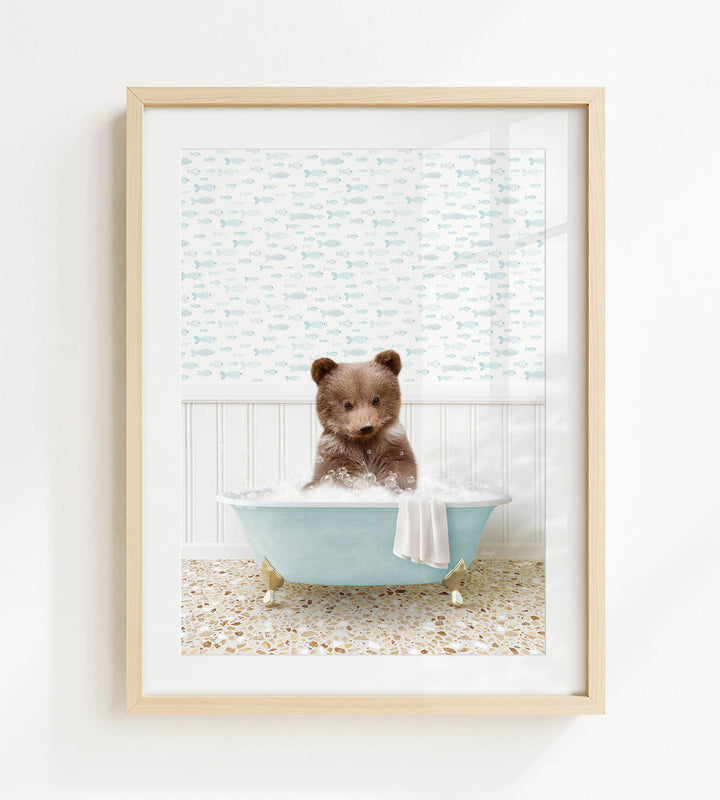 A brown bear sitting in a blue bathtub filled with bubbles, surrounded by a patterned wall and a window.