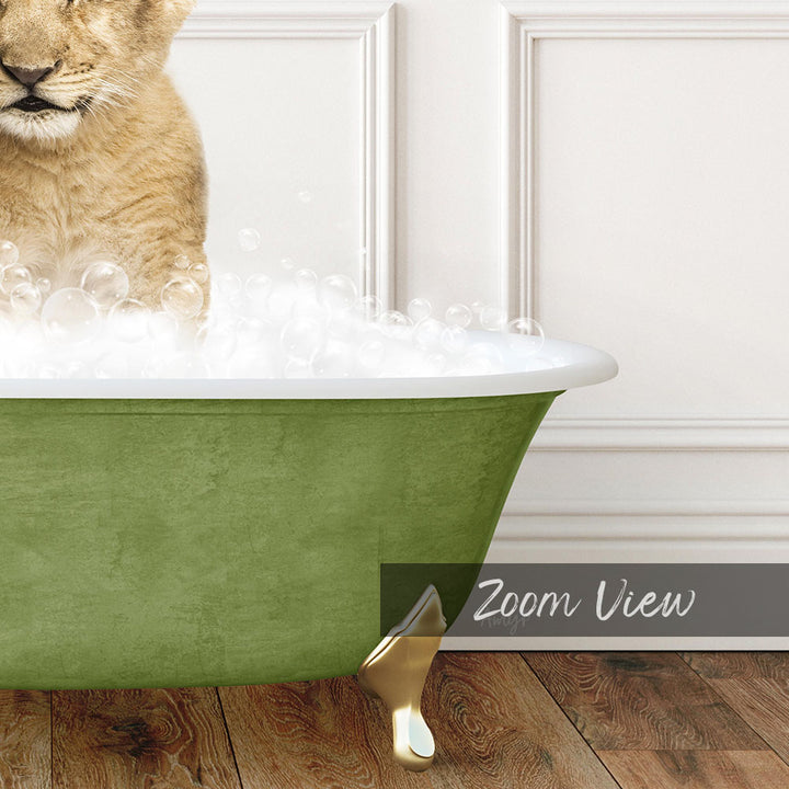 A cat is sitting in a green bathtub filled with bubbles, with a white door visible in the background.