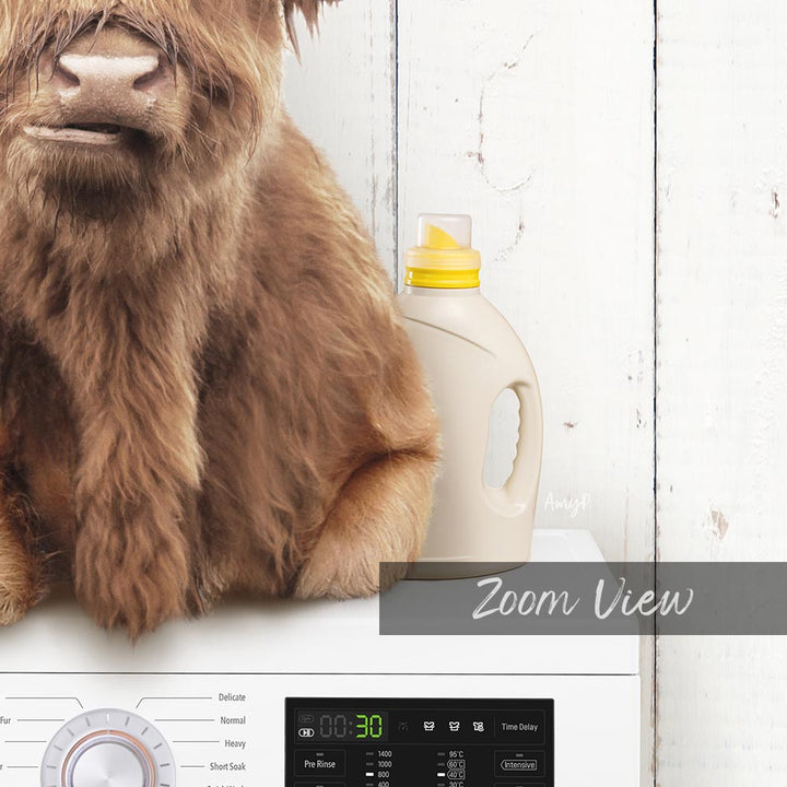 A close-up of a brown furry animal, likely a dog, sitting next to a white laundry detergent bottle on a white surface.