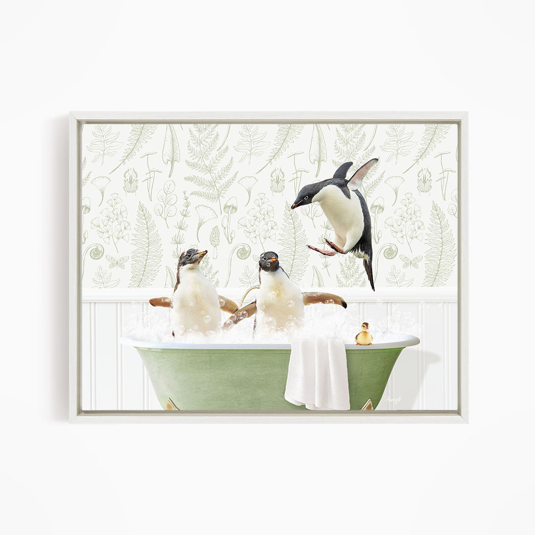 A framed image depicting three penguins sitting in a green bathtub, with one penguin flying towards the others.