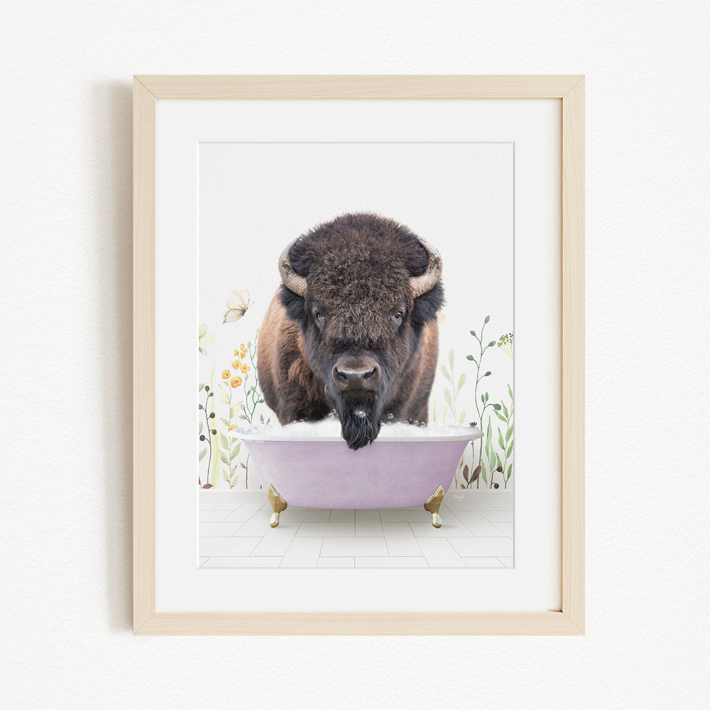 A buffalo is sitting in a pink bathtub, surrounded by flowers and butterflies, creating a whimsical and playful scene.