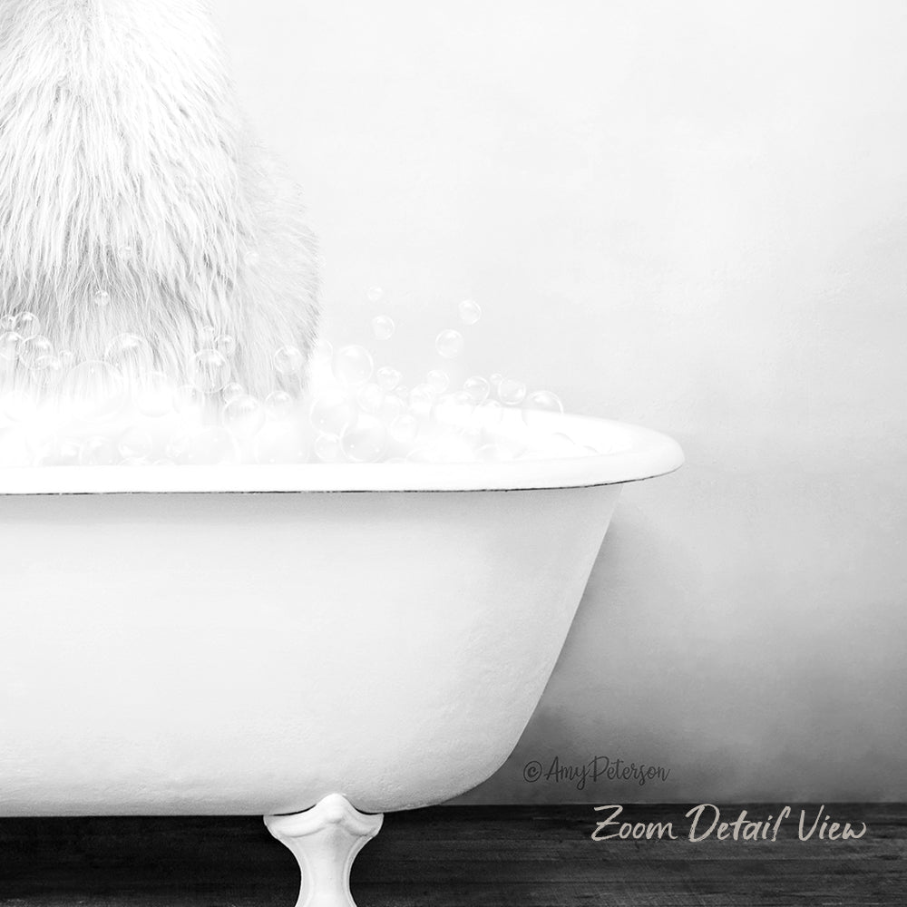 A fluffy white cat is sitting in a white bathtub filled with bubbles, creating a serene and relaxing scene.
