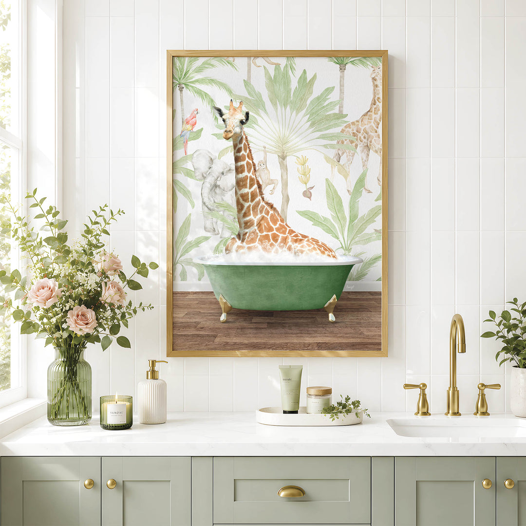 a bathroom scene with a framed painting of a giraffe sitting in a bathtub, surrounded by tropical foliage. The painting is hung on a white tiled wall above a white countertop with various bathroom accessories, including a vase of flowers, a soap dispenser, and a candle.