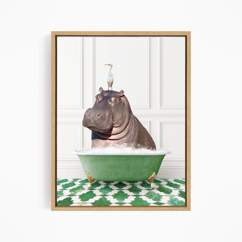A framed image depicting a hippopotamus sitting in a green bathtub, with a seagull perched on its head.