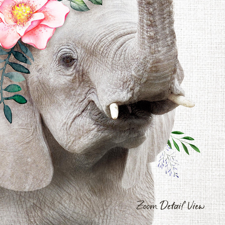 A close-up of an elephant's face, with a pink flower adorning its ear and green leaves surrounding its trunk.
