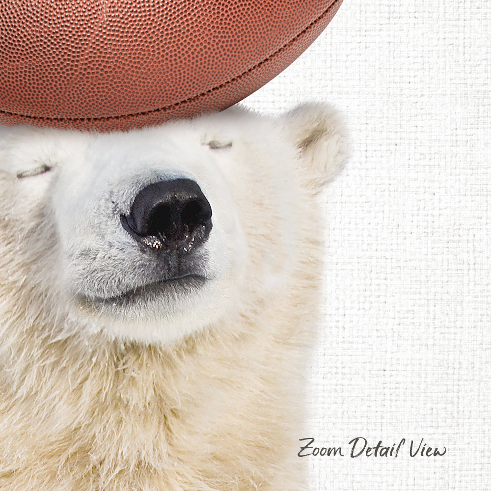 A polar bear wearing a football hat and looking at the camera.