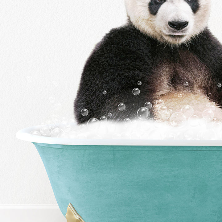 a panda bear sitting in a bathtub full of bubbles