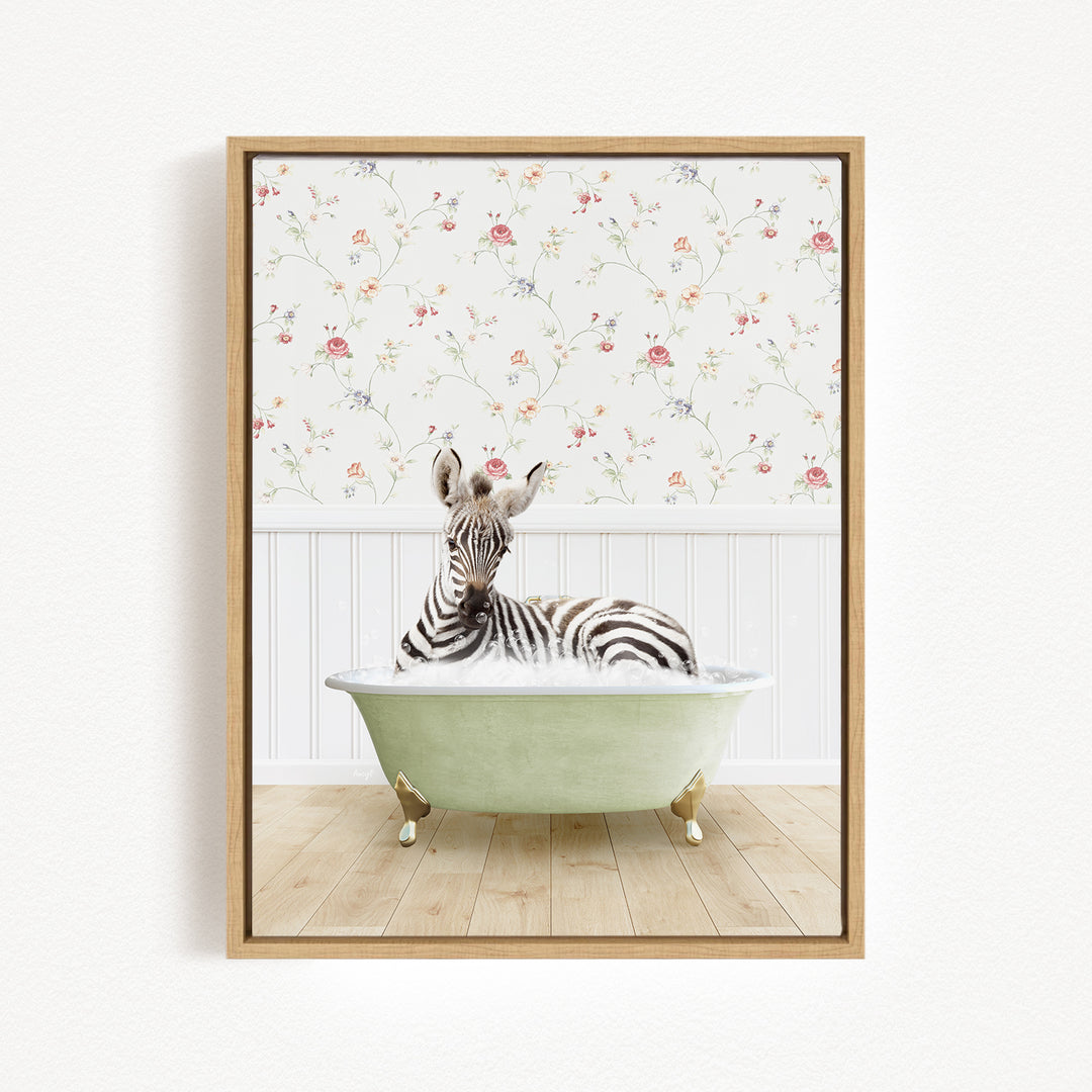 A zebra is sitting in a green bathtub, surrounded by a floral wallpaper.