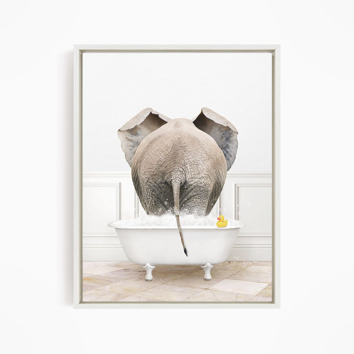 An elephant is standing in a white bathtub filled with water, with a rubber duck floating nearby.
