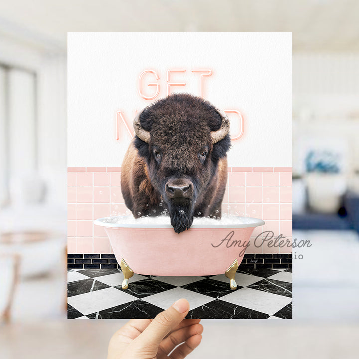 a person holding up a card with a picture of a bison in a bathtub