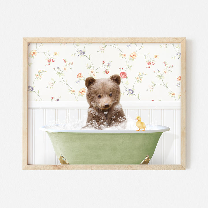 a small brown bear sitting in a bath tub