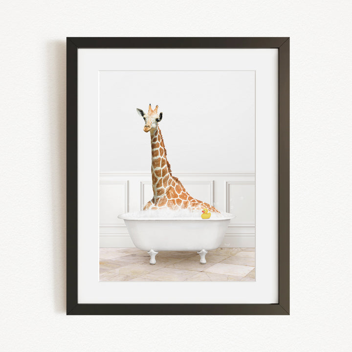 A giraffe is sitting in a white bathtub filled with water, with a yellow rubber duck floating in the water.