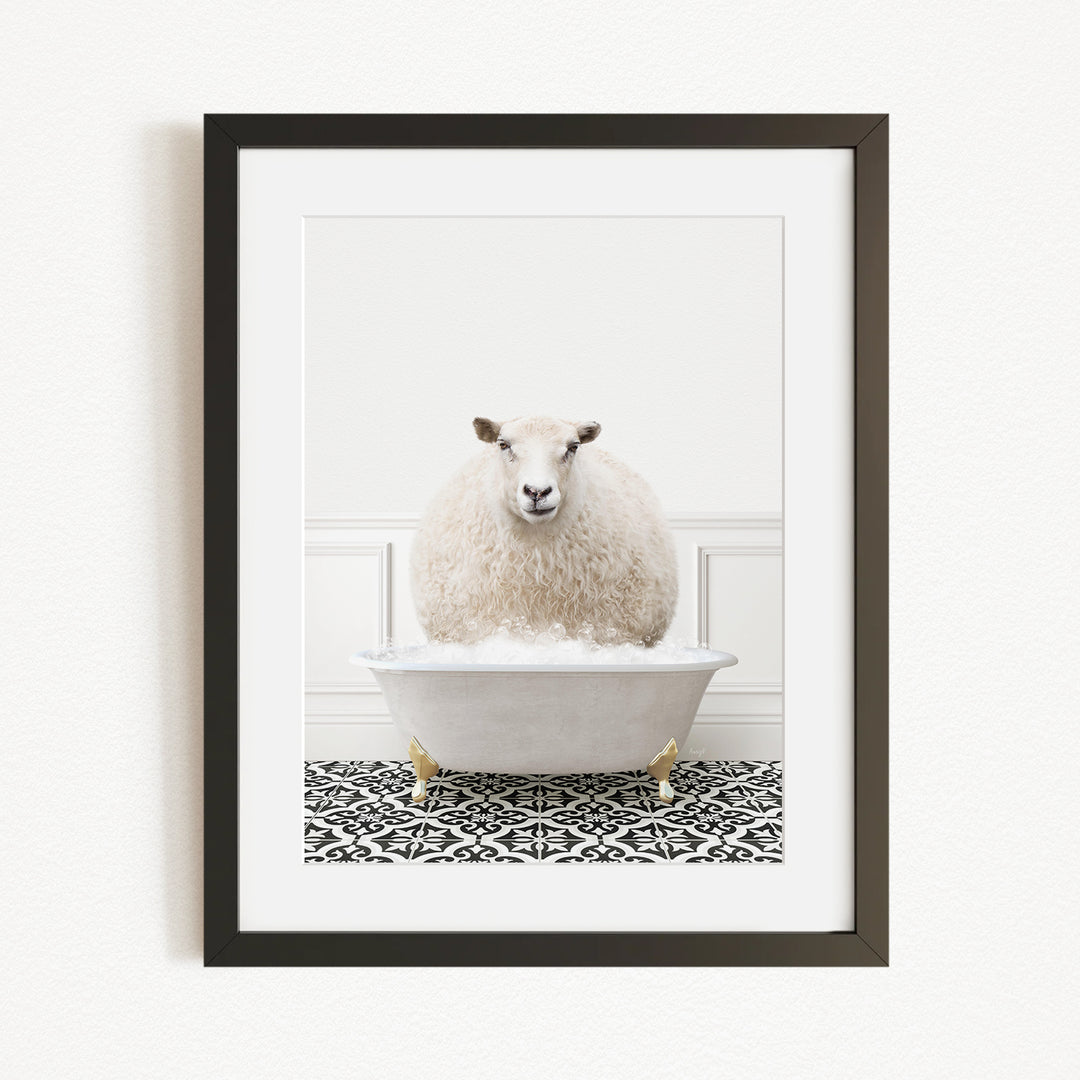 A fluffy white sheep sits in a white bathtub filled with bubbles, creating a whimsical and playful scene.