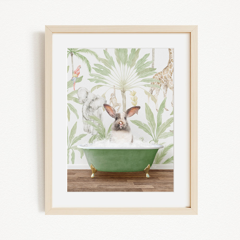 A framed print depicting a rabbit sitting in a green bathtub, surrounded by a tropical jungle scene with various animals and plants.