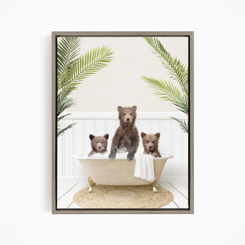 A framed image depicting three bears sitting in a bathtub, surrounded by green palm leaves.