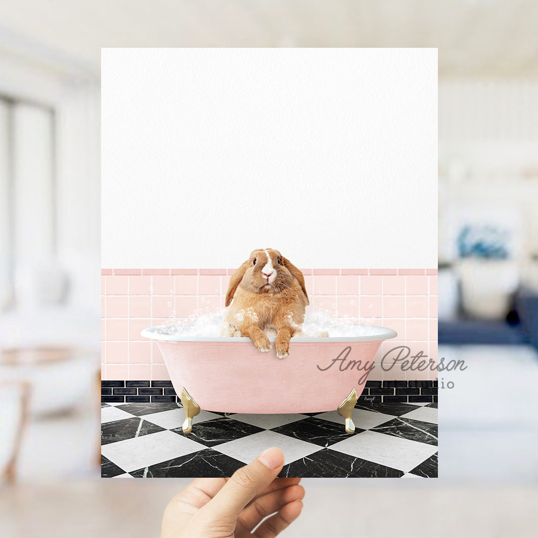 a person holding up a card with a picture of a rabbit in a bathtub