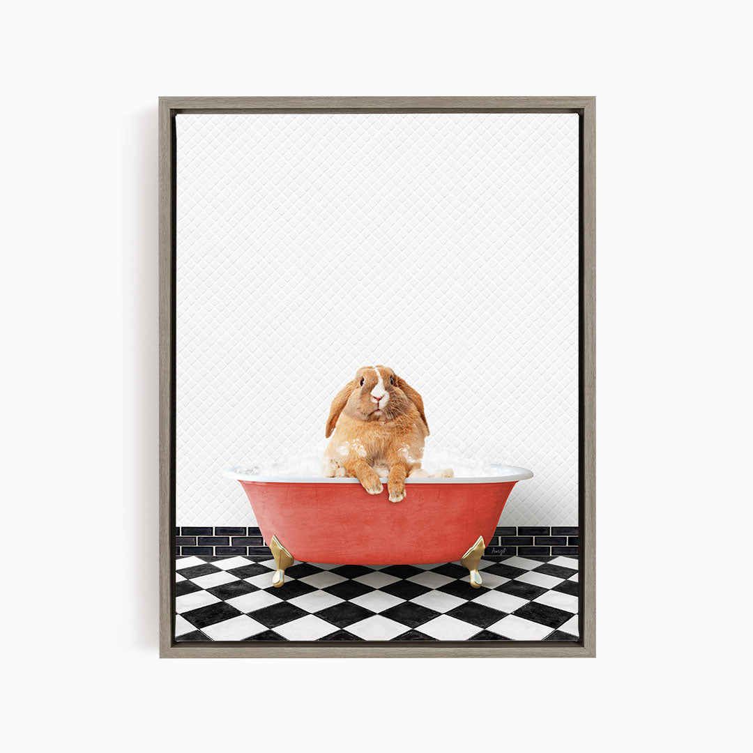A brown rabbit sitting in a red bathtub filled with bubbles, surrounded by a black and white checkered floor.