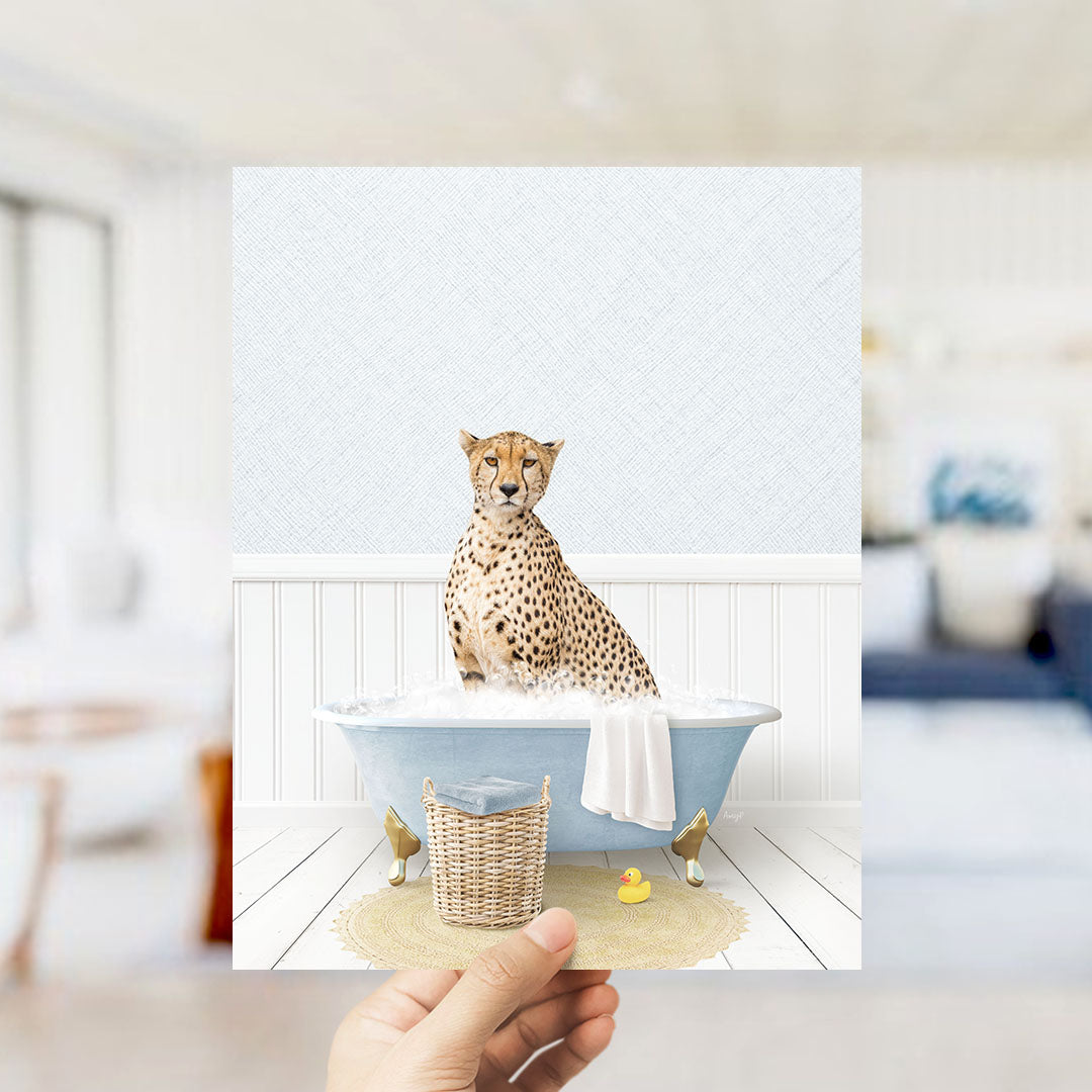 A cheetah sitting in a bathtub filled with water, surrounded by a yellow rubber duck and a wicker basket.