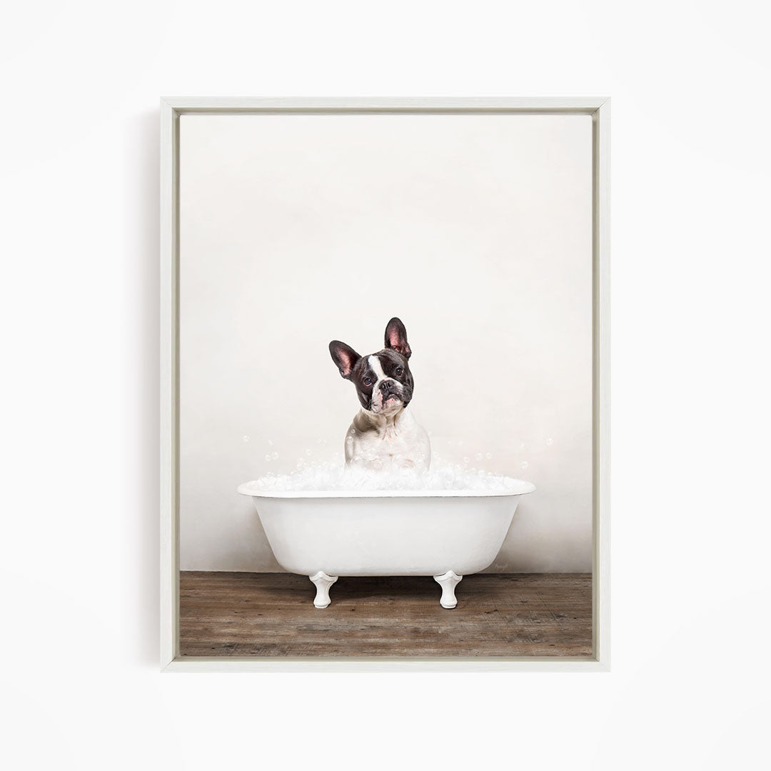 A dog sitting in a white bathtub filled with water, looking up at the camera with a playful expression.