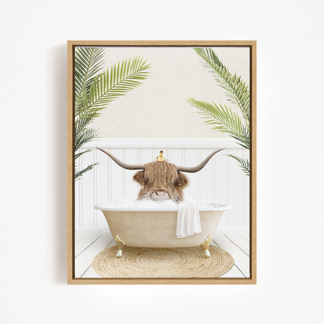 A cow with large horns is sitting in a bathtub filled with water, surrounded by palm leaves.