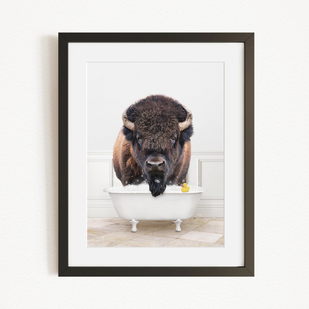 A buffalo with a yellow rubber duck in a white bathtub, creating a whimsical and playful scene.