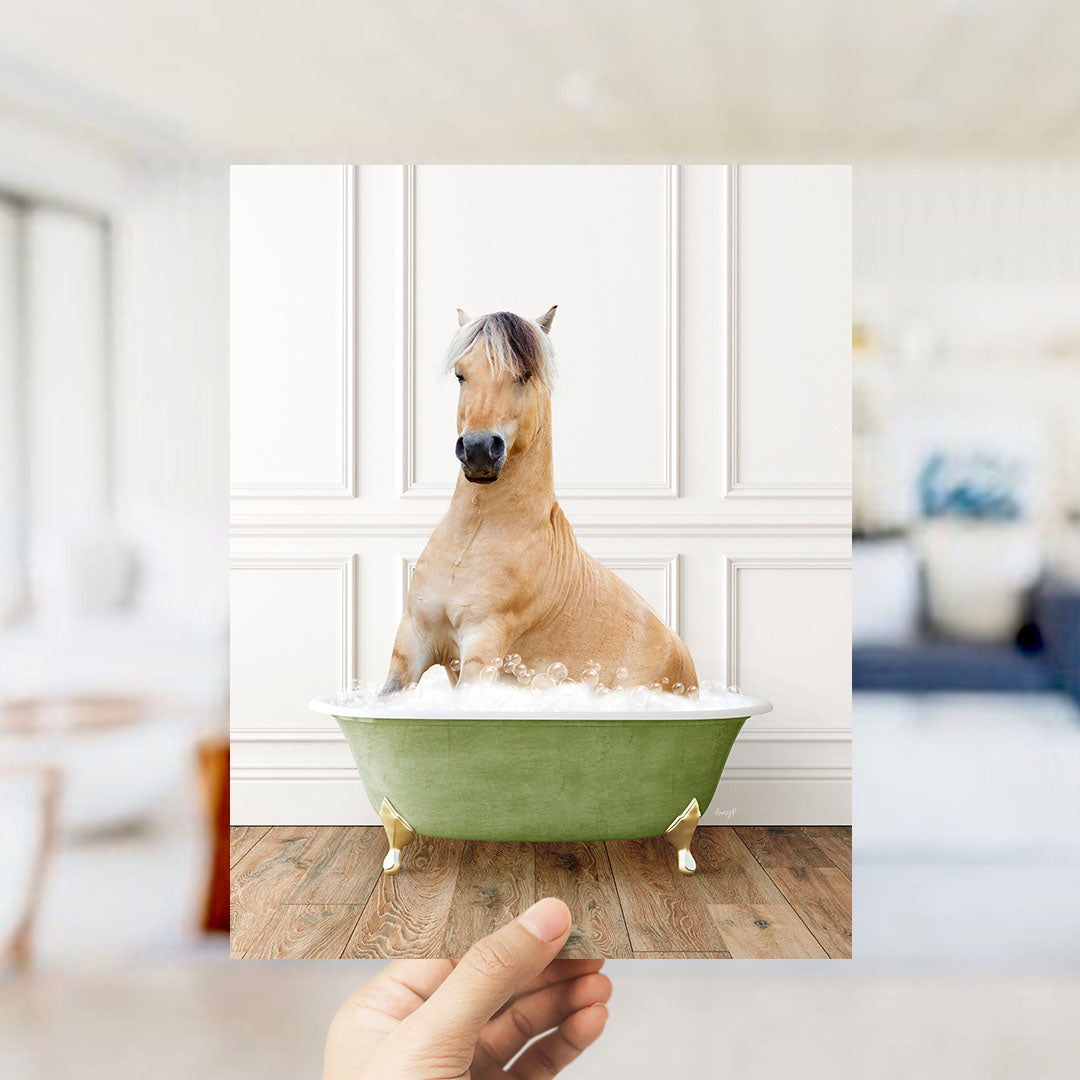 A light brown horse sitting in a green bathtub filled with water, with a blurred background suggesting a living room setting.