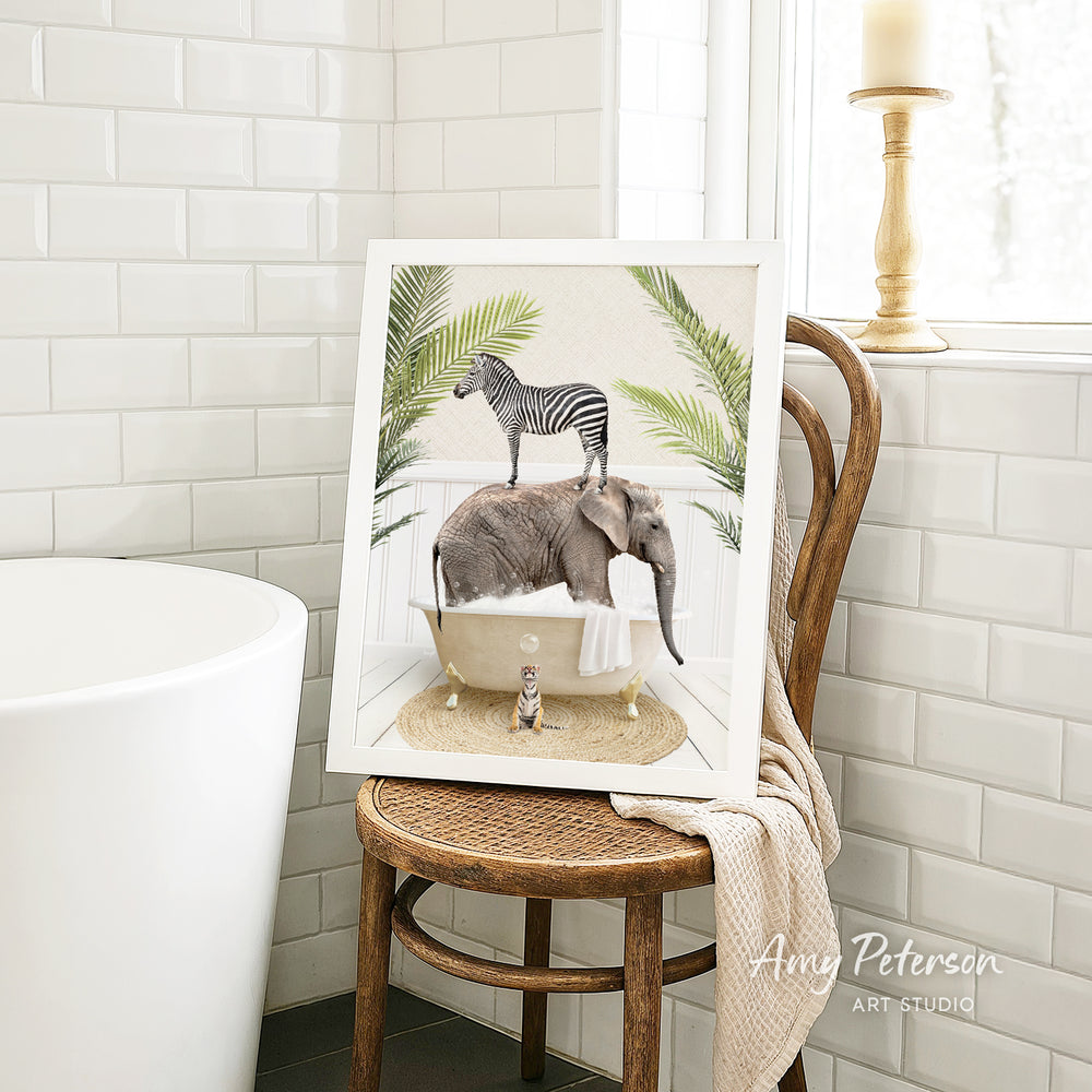 A framed image depicting a zebra standing on an elephant in a bathtub, with a cat sitting on the elephant's back.