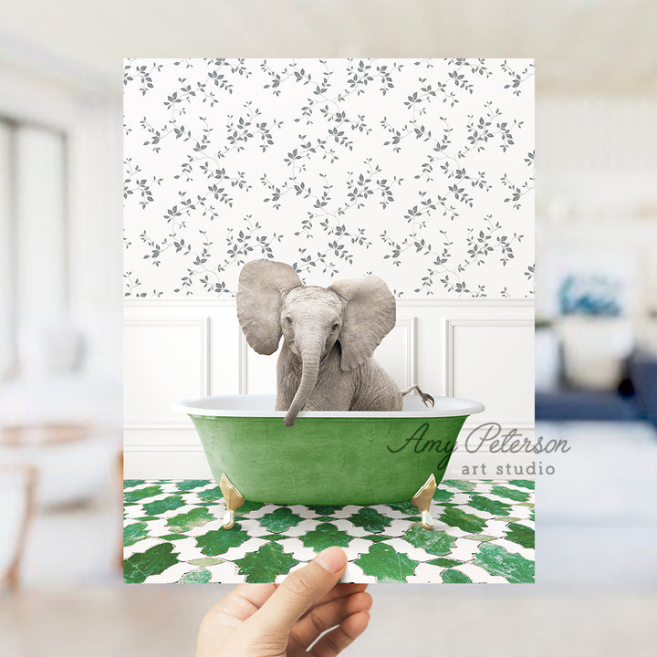 a hand holding a card with an elephant in a bathtub