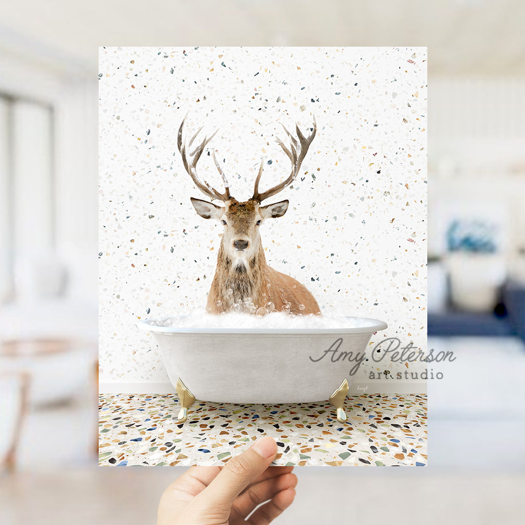 a hand holding up a card with a picture of a deer in a bathtub