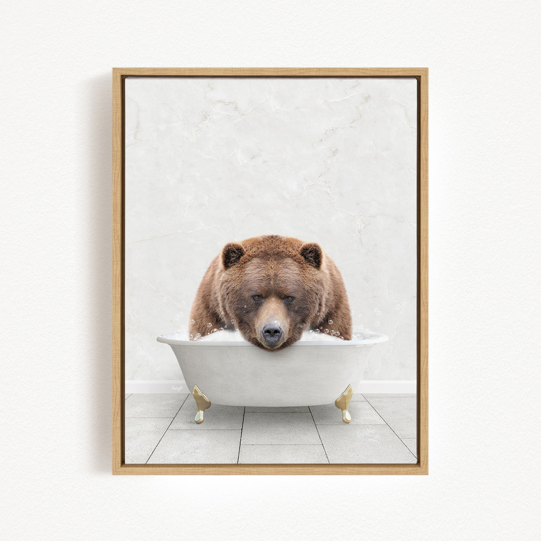 A brown bear is sitting in a white bathtub, appearing relaxed and content.