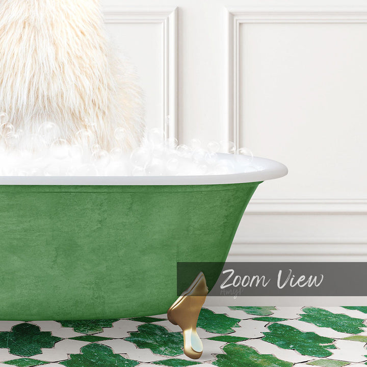 A fluffy white dog is sitting in a green bathtub filled with bubbles, with a gold bathtub leg visible.