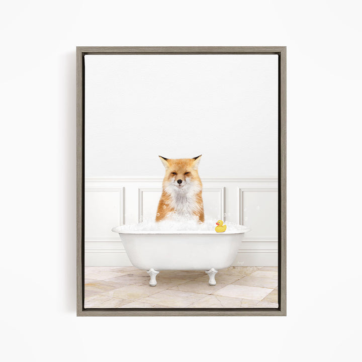 A red fox is sitting in a white bathtub filled with water, with a rubber duck floating in the tub.