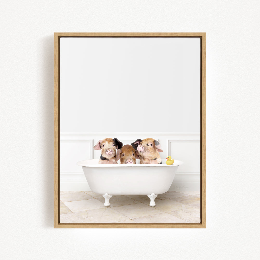 Three adorable pigs sitting in a white bathtub, with a yellow rubber duck floating in the water.