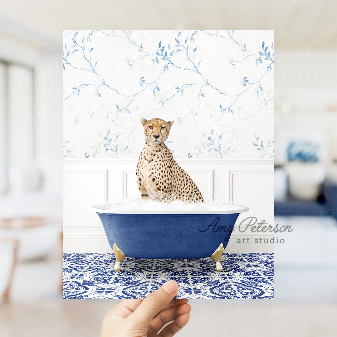 a hand holding a card with a picture of a cheetah in a bath