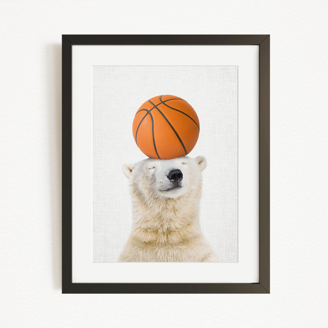 A polar bear balancing a basketball on its head.