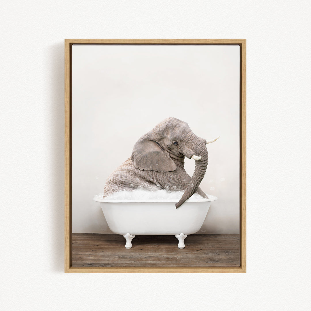 A gray elephant sitting in a white bathtub filled with water, creating a whimsical and playful scene.