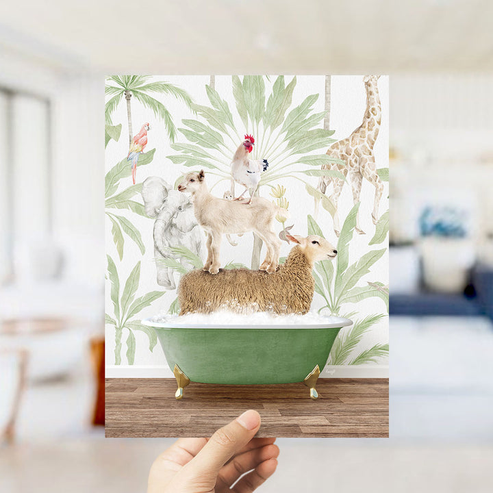 A hand holds up a framed image depicting a whimsical scene of animals, including a dog, cat, and bird, standing on a green bathtub filled with water, surrounded by tropical foliage.