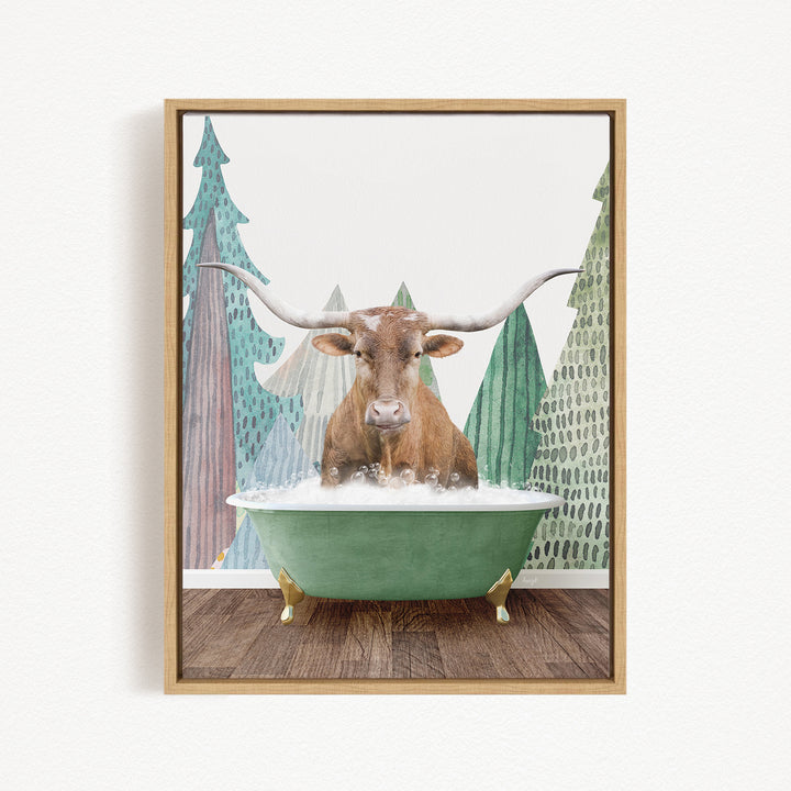 A brown cow with large horns is sitting in a green bathtub, surrounded by trees with green and brown foliage.