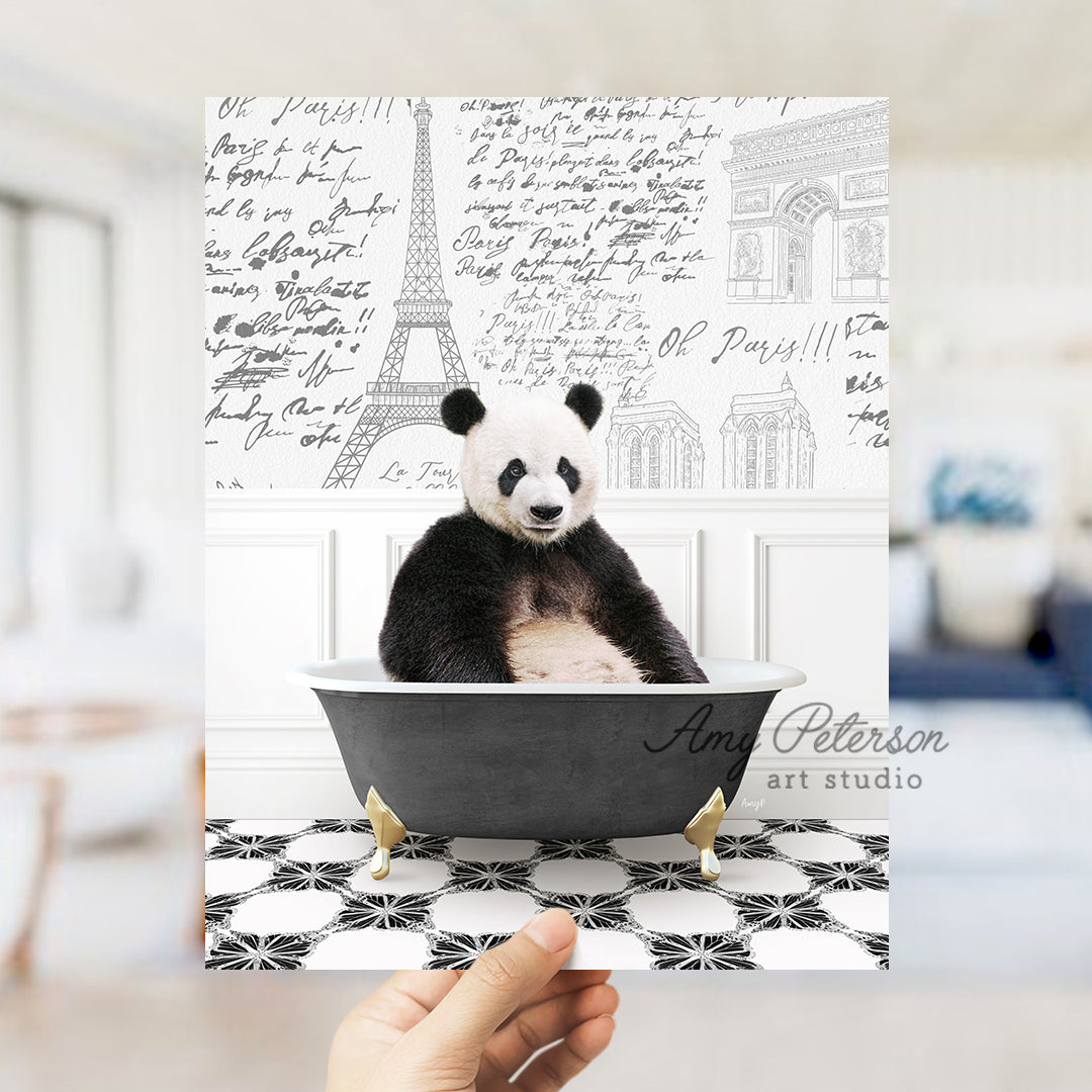 a person holding up a card with a panda in a bathtub