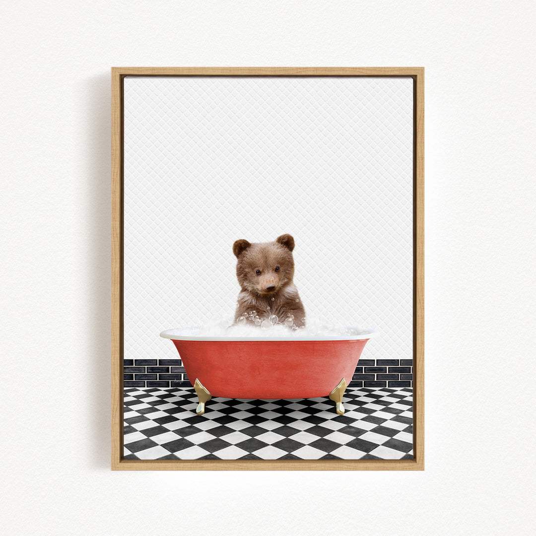 A small brown bear is sitting in a red bathtub filled with water, surrounded by a black and white checkered floor.