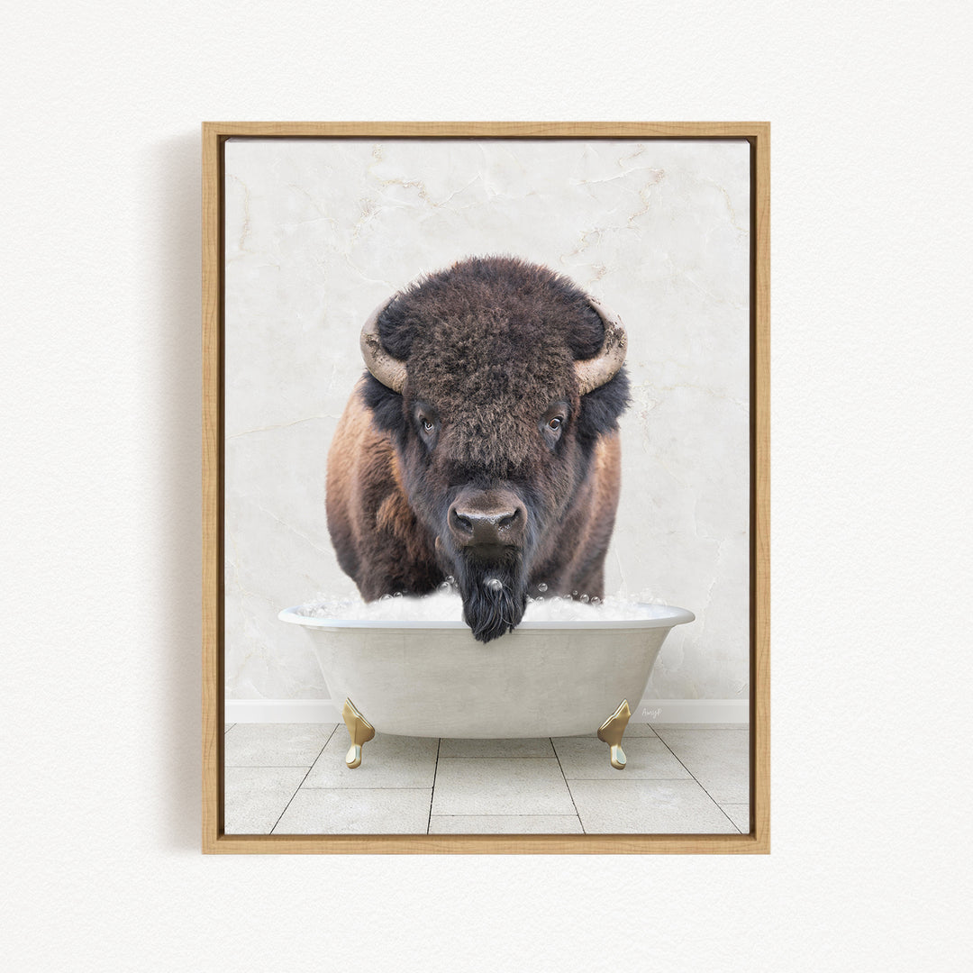 A buffalo with a long beard is sitting in a white bathtub, with its head above the water.