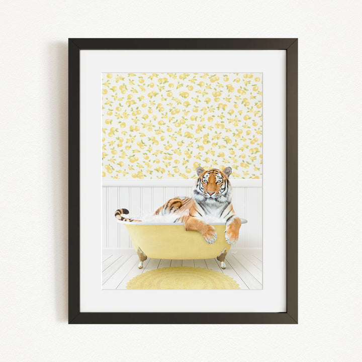 A tiger is sitting in a yellow bathtub, surrounded by a yellow and white floral pattern on the wall behind it.