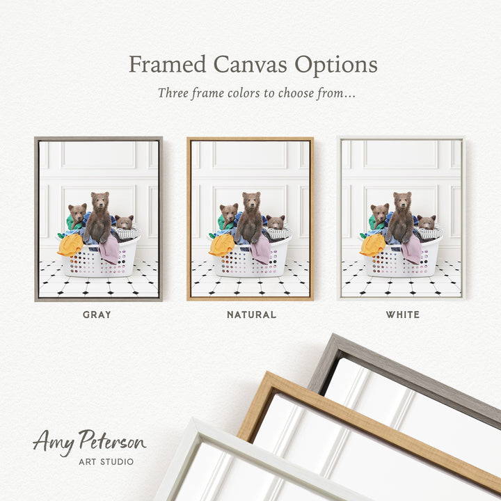 three framed canvas options, each featuring a bear sitting in a basket. The options include a gray frame, a natural frame, and a white frame. The text above the images reads " Framed Canvas Options" and "Three frame colors to choose from...".
