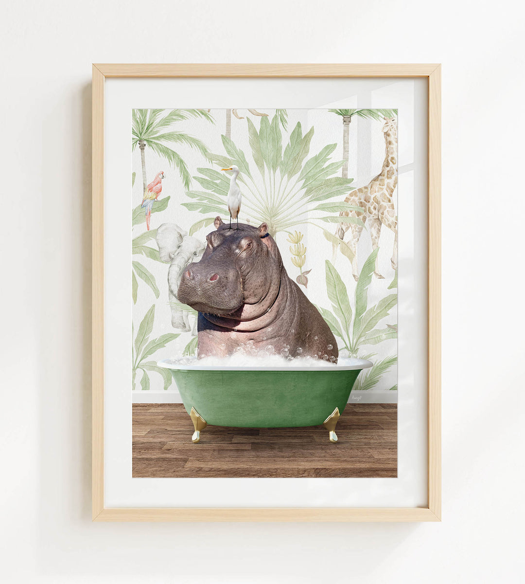 A framed image depicting a hippopotamus sitting in a green bathtub, surrounded by tropical foliage and a giraffe in the background.