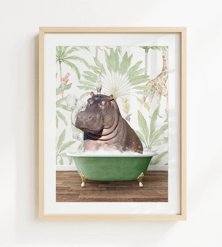A framed image depicting a hippopotamus sitting in a green bathtub, surrounded by tropical foliage and a giraffe in the background.
