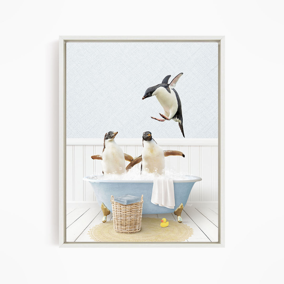 A framed image depicting two penguins sitting in a bathtub, with one penguin flying towards the other penguin.