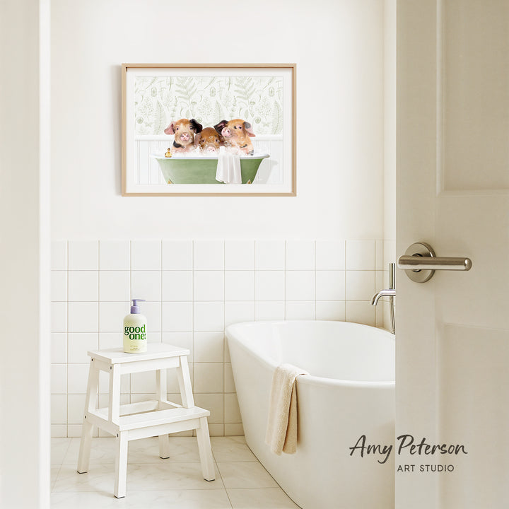 A framed image of three guinea pigs sitting in a bathtub, with a white tiled wall and a white bathtub in the bathroom.